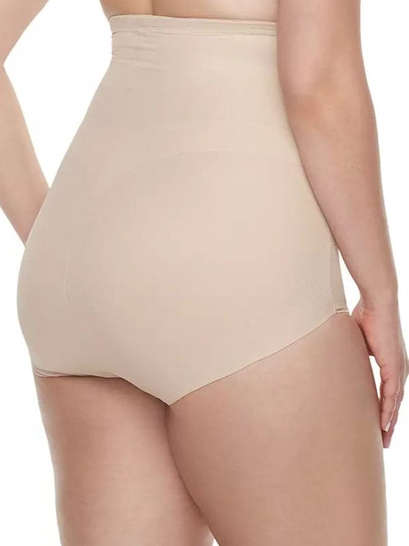 a woman wearing a beige shaping brief