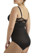 a woman wearing black plus size tummy control underwear shapewear