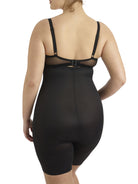 a woman wearing a black plus size tummy control shapewear short