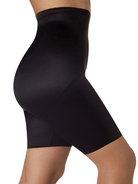 a woman wearing a black plus size tummy control shapewear short