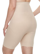 a woman wearing a nude plus size tummy control shapewear short