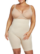 a woman wearing a nude plus size tummy control shapewear short