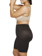 a woman wearing black plus size tummy control shapewear shorts