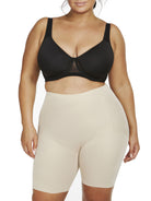 a woman wearing nude plus size tummy control shapewear shorts