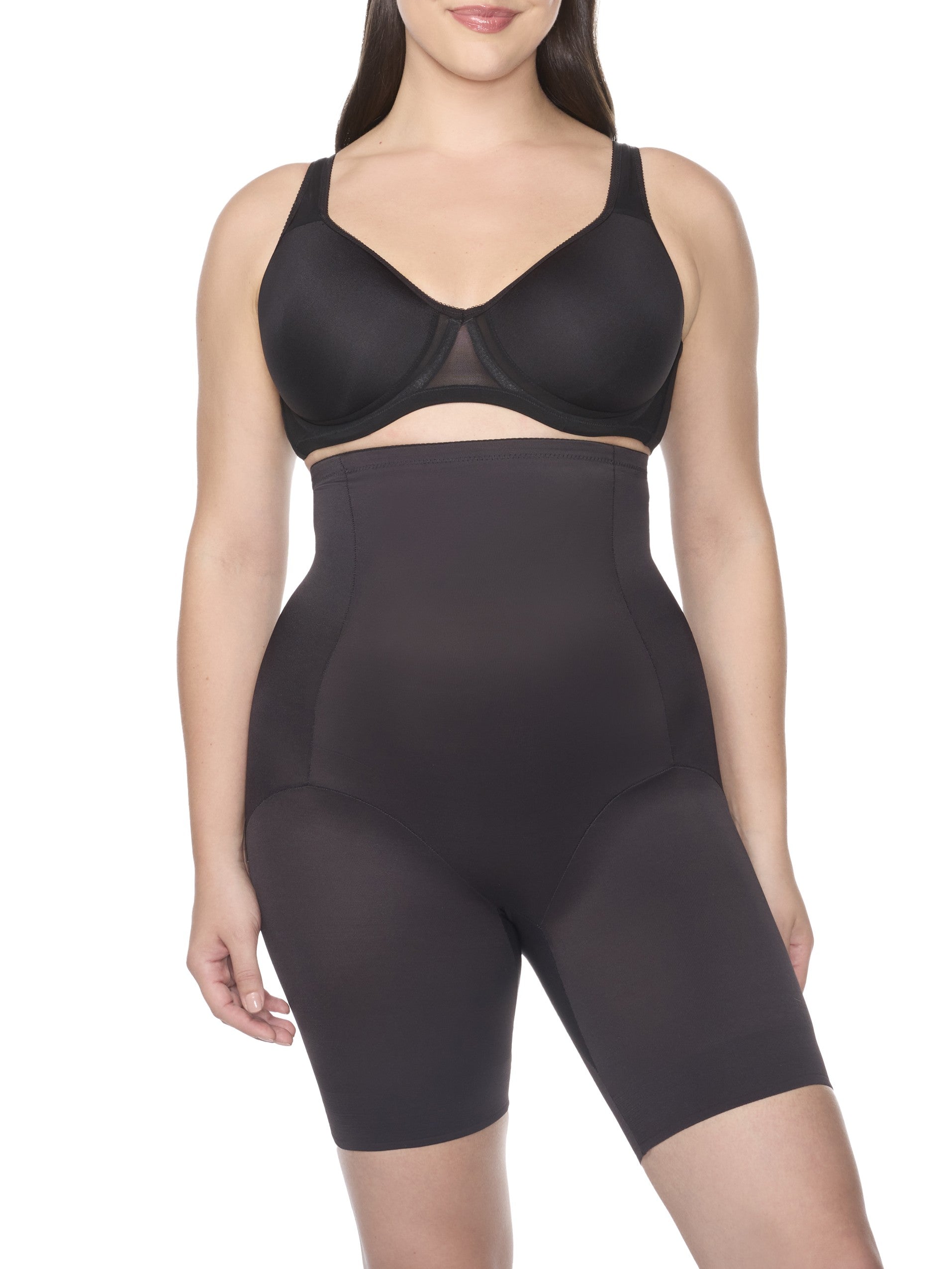 a woman wearing black high waisted tummy control shapewear shorts