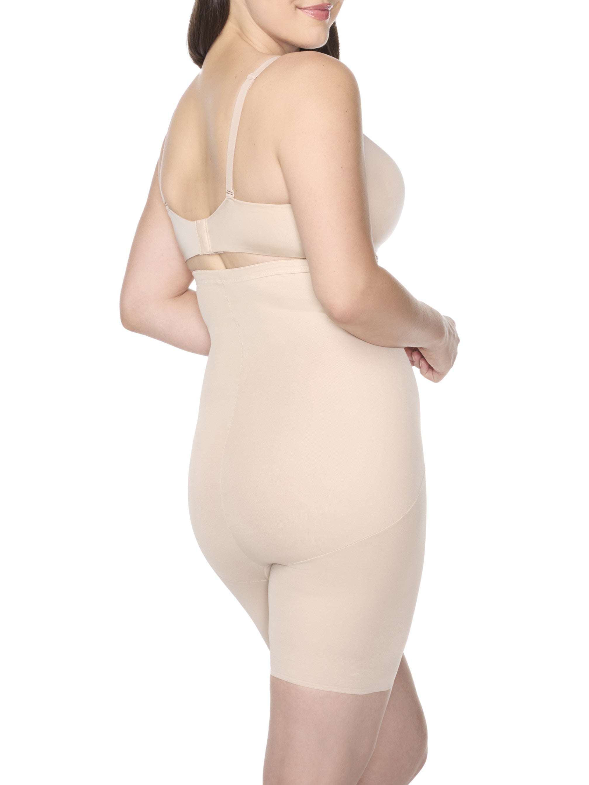 a woman wearing nude high waisted tummy control shapewear shorts