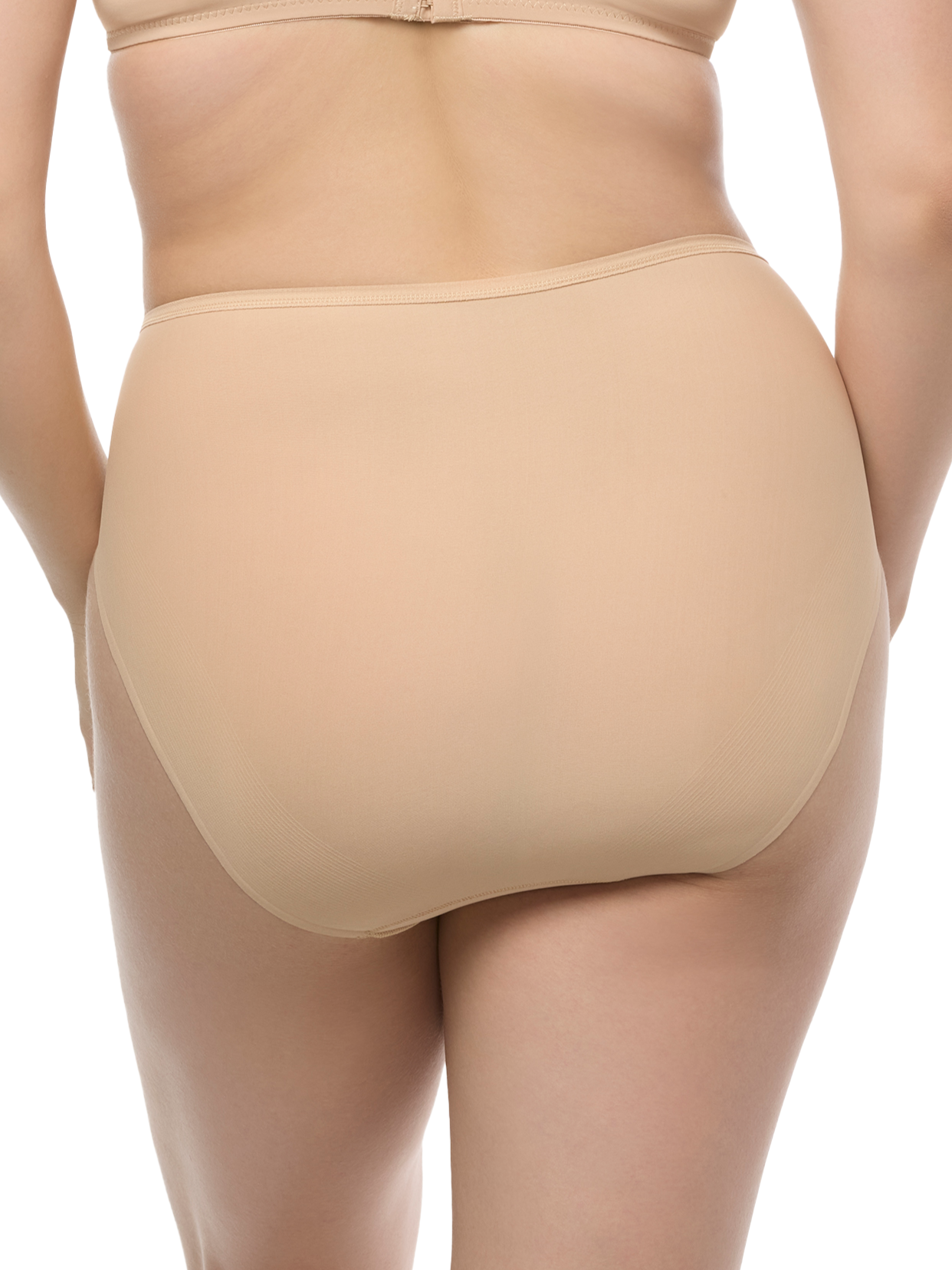 a woman wearing a beige high cut brief panty french cut