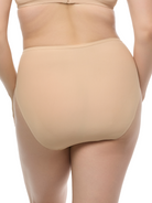 a woman wearing a beige high cut brief panty french cut