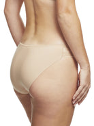 a woman wearing a beige bikini panty