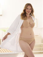 a woman wearing a white robe and beige lace trim women's underwear hipster panties women's panties all-groups