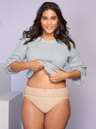 a woman wearing a nude high cut brief panty and a light blue sweater all-groups