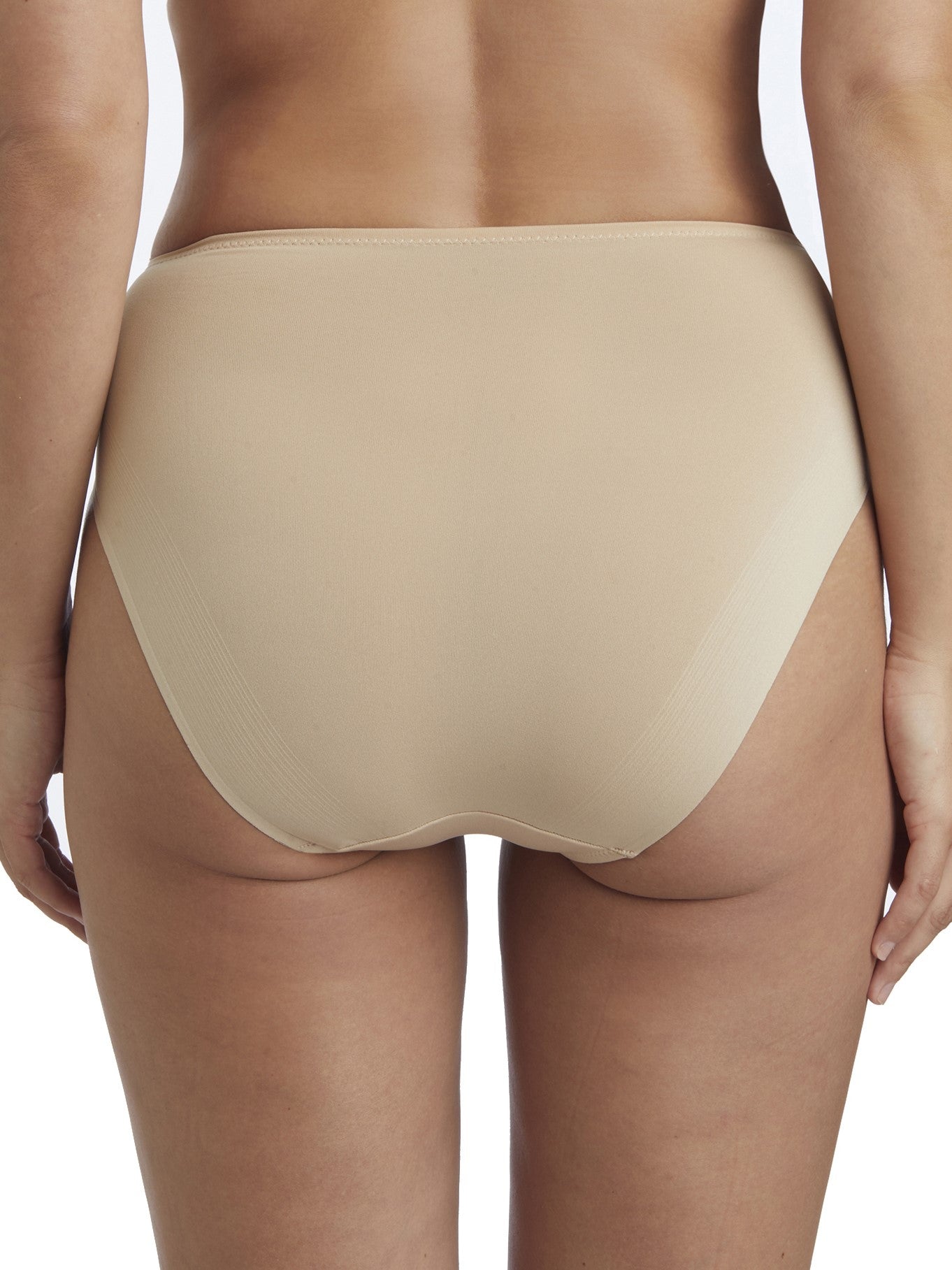 a woman wearing a beige high-cut brief panty