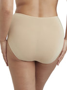 a woman wearing a beige brief panty