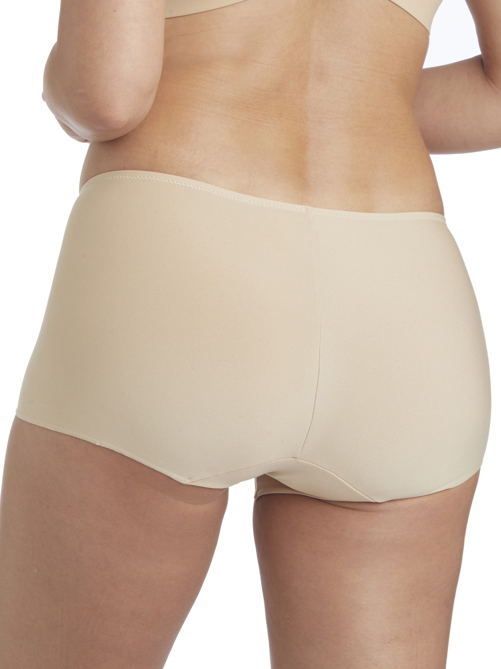 a woman wearing a beige boyshort panty