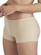 a woman wearing a beige boyshort panty