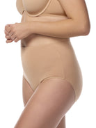 a woman wearing tan cotton blend women's brief panty