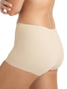 a woman wearing a beige boyshort panty