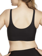 a woman wearing a black bralette