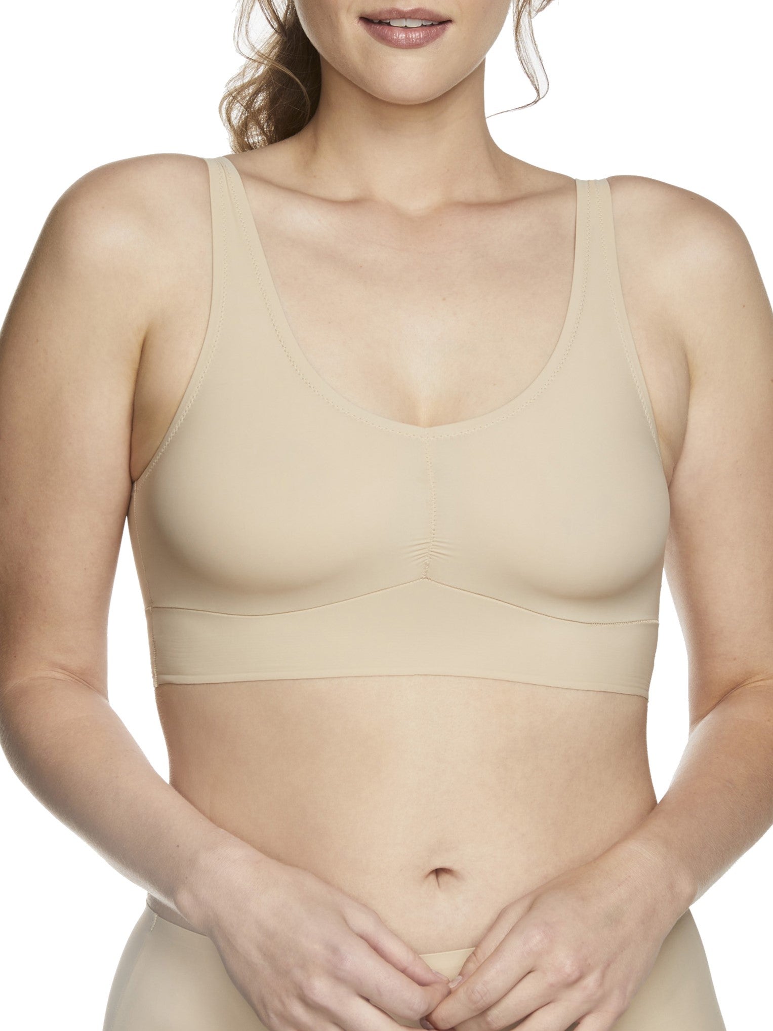 a woman wearing a beige bralette