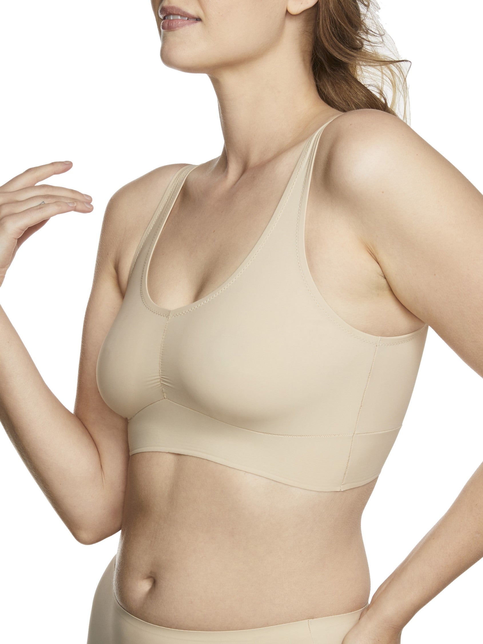 a woman wearing a beige bralette