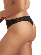 a woman wearing a black thong panty