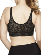 a woman wearing a black lace bralette