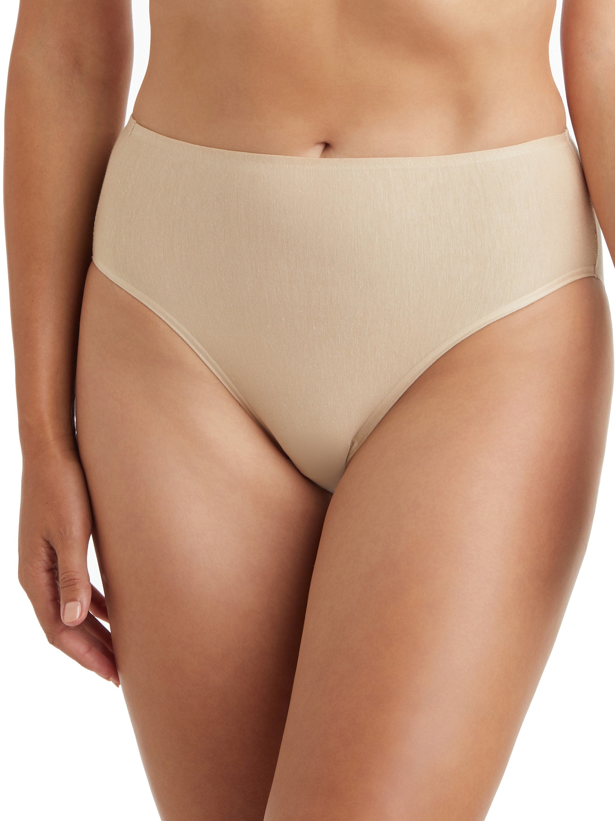 a woman wearing a beige high-cut brief panty