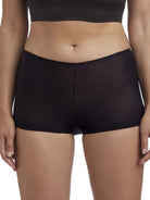 a woman wearing a black boyshort panty