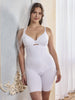 a woman wearing a white high waisted thigh slimmer shapewear short in a bathroom all-groups